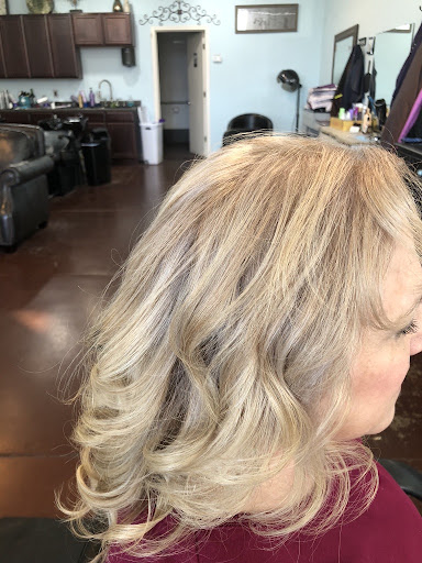 Soft blonde waves finished with dimension and shine